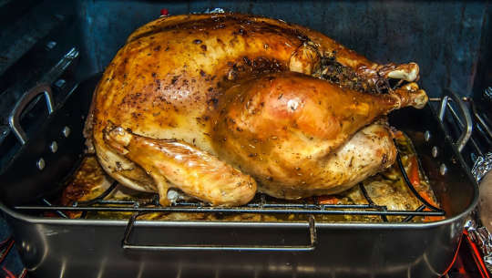 Should You Stop Washing Your Turkey and Other Poultry? turkey roasting in the oven
